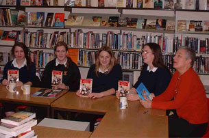 Elaine Davis (Librarian) with some of Clyst Vale Community College's year 11 Book Club discussing the book in Devon.