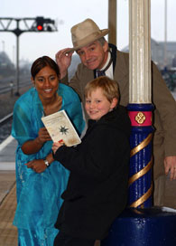 Manjit Sylvester-Jhalli as Princess Aouda and Simon Cook as Phileas Fogg with a pupil from Hannah More School in Bristol.