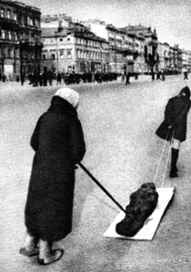 Moving dead body through city street.