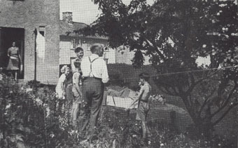 A family enjoying their new Sea Mills' garden in the 1930s.