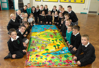 Pupils at Fair Furlong Primary with their Portrait of a Nation collage (Martin Chainey).