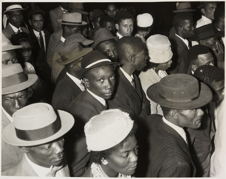 Crowds of people recently arrived in Britain from the Caribbean waiting to pass through immigration at Victoria Station, London 1962. 