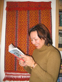 A copy of Small Island has travelled from Glasgow to Kazakhstan and is pictured being read by Aida Macleod.